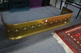 A pierced brass fender.