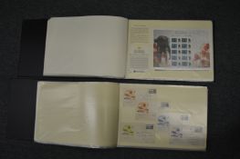 Two large albums containing a collection of Australian stamps and related items.