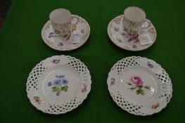 A pair of small Meissen floral decorated plates with pierced borders together with a pair of Dresden