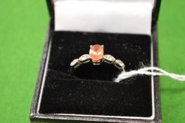 A decorative silver ring, size P½.