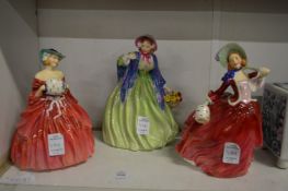 Three Doulton figurines.