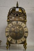 A reproduction lantern clock.