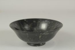 AN ISLAMIC HARDSTONE BOWL, 13.5cm diameter.