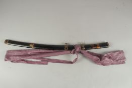A LATE 19TH - EARLY 20TH CENTURY JAPANESE BLACK LACQUER AND GILT DECORATED TACHI SAYA, with metal