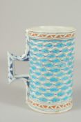 AN OTTOMAN TURKISH IZNIK POTTERY TANKARD, 20cm high.