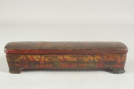 A LARGE QAJAR PAPIER MACHE PEN BOX, 30cm long.