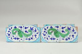 A PAIR OF 18TH-19TH CENTURY MUGHAL NORTH INDIAN MULTAN POTTERY TILES, each 30cm x 15cm.