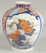 FINE JAPANESE IMARI PORCELAIN BULBOUS VASE, beautifully painted with panels of birds and native