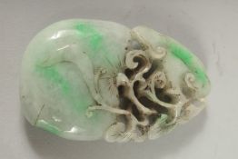 A CARVED JADE PENDANT 3.5ins X 2ins