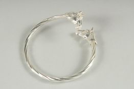 A STERLING SILVER TORQUE STYLE HORSE HEAD BANGLE.