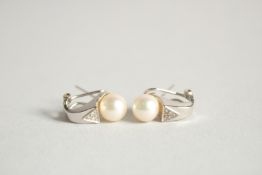 A PAIR OF WHITE GOLD, PEARL AND DIAMOND EAR CLIPS.