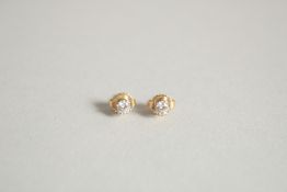 A SMALL PAIR OF DIAMOND STUD EARRINGS.