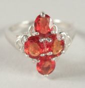 A FOUR STONE RUBY RING.
