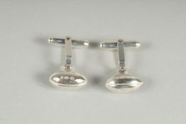A PAIR OF STERLING SILVER RUGBY BALL CUFF LINKS.