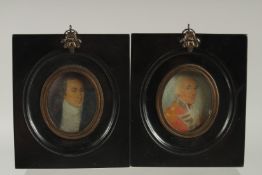 A SMALL PAIR OF RED TOLEWARE TINS AND COVERS. 7ins high.