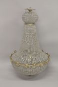 A LARGE CRYSTAL AND ORMOLU CHANDELIER. 3ft 6ins high.