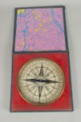 A FRAMED CIRCULAR COMPASS. 8ins high.