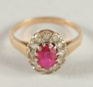 A 9CT GOLD OVAL CLUSTER RING.