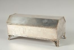 A GOOD SILVER PLATED DESK INK CASKET with rising top and fitted interior. 9ins long.