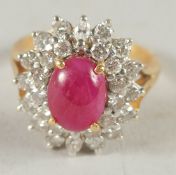 A GOOD LARGE 18CT GOLD RUBY AND DIAMOND DRESS RING..