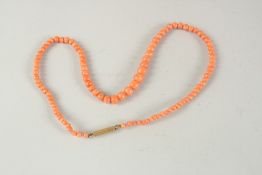 A CORAL NECKLACE 17ins long.