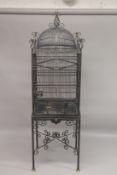 A LARGE IMPRESSIVE PAGODA STYLE BRASS BIRDCAGE AND STAND. 7ft 4ins high x 2ft 2ins wide.
