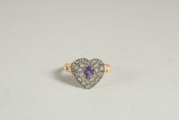 AN AMETHYST AND ROSE DIAMOND HEART SHAPED RING.