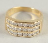 AN 18CT GOLD TRIPLE DIAMOND BAND RING.