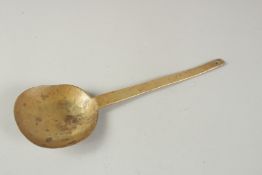 A 16TH CENTURY BRASS SPOON. 9.5ins long.