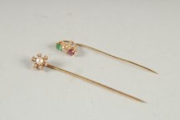 AN 18CT GOLD DIAMOND & PEARL PIN and A RUBY AND DIAMOND PIN (2).