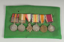 J. ARNOLD A.S. C. A GROUP OF 5 MEDALS: QUEENS SOUTH AFRICA MEDAL and four bars. George VII, South