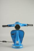 A BLUE VESPA LAMP.