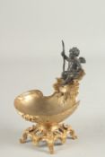 A BRONZE AND GILT BRASS SHELL SHAPE TABLE SALT with cherub mounts. 7ins high.