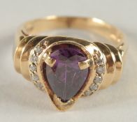 A 14CT GOLD AMETHYST AND DIAMOND RING.