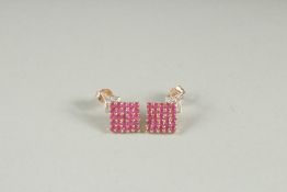 A PAIR OF 0F 9CT YELLOW GOLD RUBY AND DIAMOND EARRINGS.