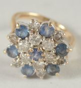 A GOOD DIAMOND AND SAPPHIRE CLUSTER RING.