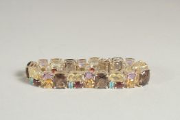 A SILVER MULTI COLOURED STONE NECKLACE.