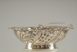 A GEORGE III PIERCED SILVER BON BON BASKET with swing handles. London 1771. Maker: A. R. P.
