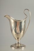 A GEORGE III SILVER HELMET SHAPED CLARET JUG. London 1790. Maker: Robert Hennel.