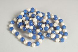 A LONG STRING OF LAPIS AND PEARLS. 46ins long.