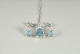 AN 18CT WHITE GOLD, AQUAMARINE AND DIAMOND PENDANT AND CHAIN with matching ear studs.