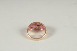A 14CT GOLD RUBY GYPSY RING.