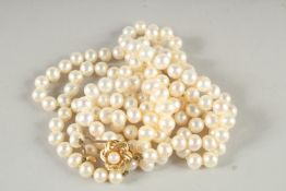 A GOOD DOUBLE ROW PEARL NECKLACE with gold clasp.