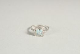 A SQUARE ART DECO AQUAMARIE AND DIAMOND RING in white gold.