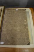 A folder of prints and artwork.