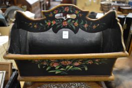 A floral painted wooden cutlery carrier.