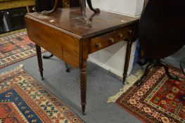 An unusual 19th century mahogany Pembroke table with a pair of drawers to one end on wrythen