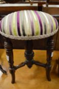 A Victorian mahogany piano or dressing table stool.