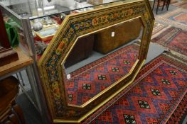 A good large octagonal shaped mirror with decorative floral frame.