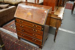 An Edwardian inlaid mahogany bureau.